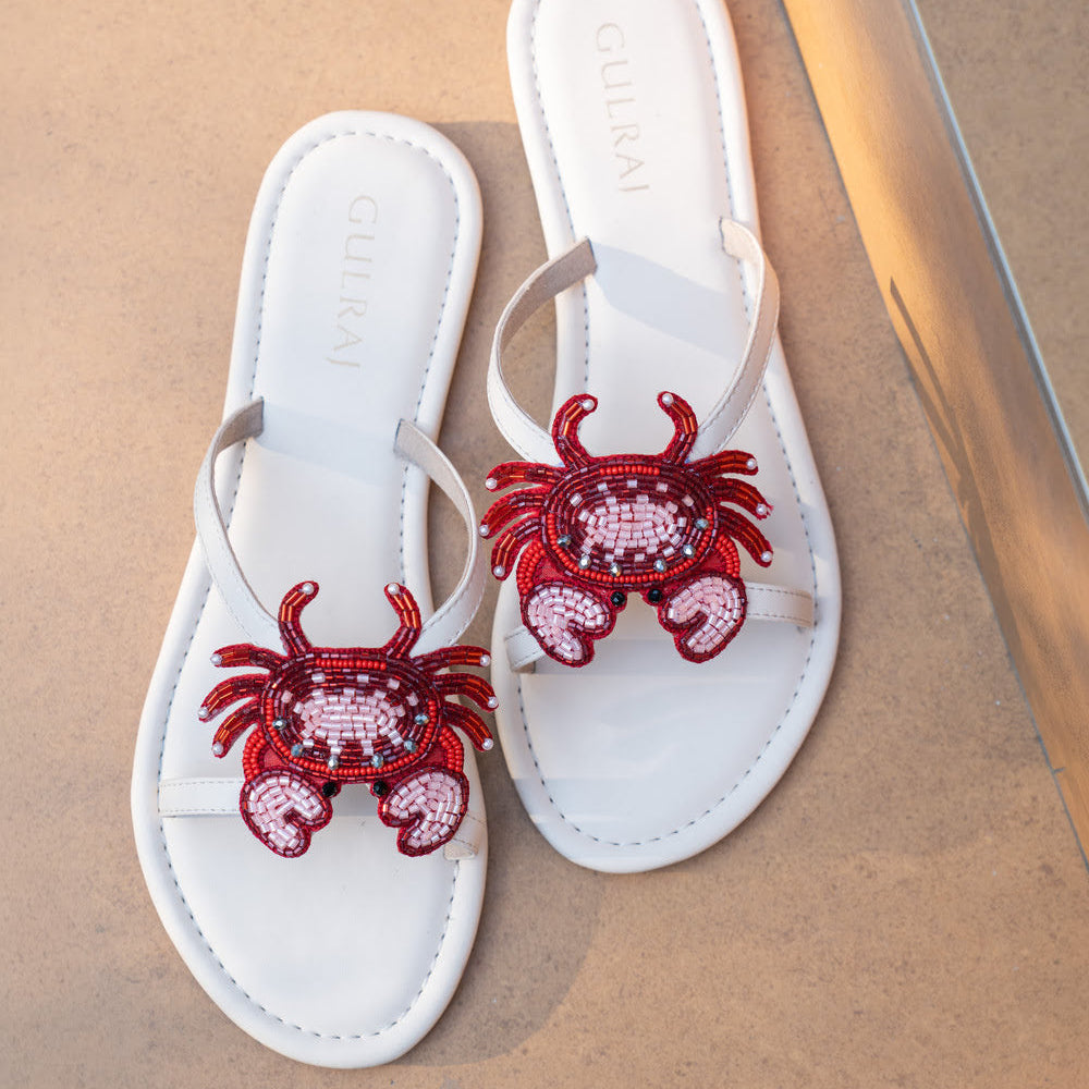 Gulraj handcrafted crab slides featuring artisanal beadwork on cream leather sandals, inspired by coastal summers and seaside escapes.
