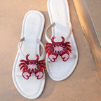 Gulraj handcrafted crab slides featuring artisanal beadwork on cream leather sandals, inspired by coastal summers and seaside escapes.