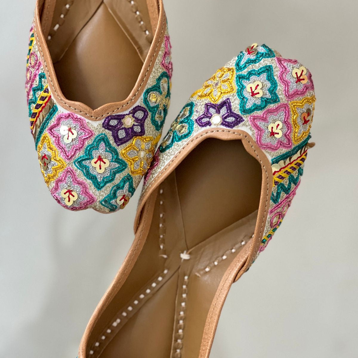 embroidered juttis women
handcrafted ethnic juttis India
lightweight juttis women
everyday ethnic footwear
comfortable juttis women